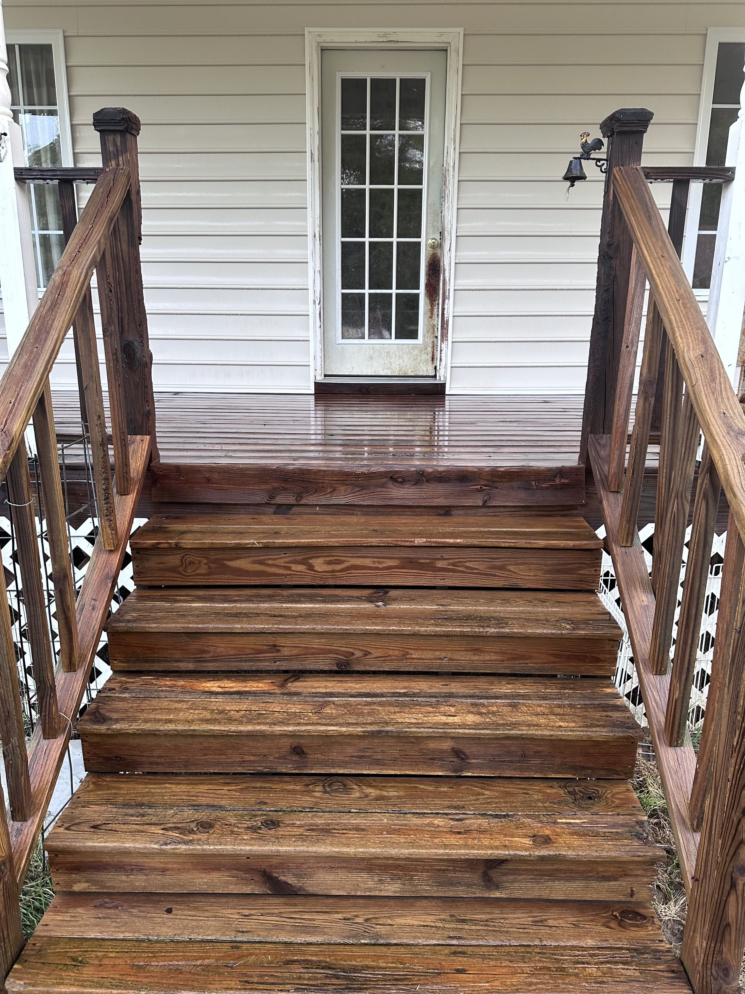 Clean driveway and siding after pressure washing